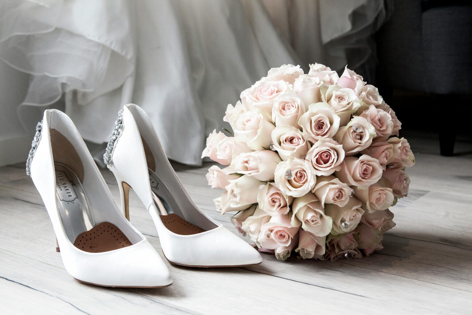 pexels-photo-313707-313707 Elegant bridal shoes and bouquet of roses perfect for wedding inspirations.